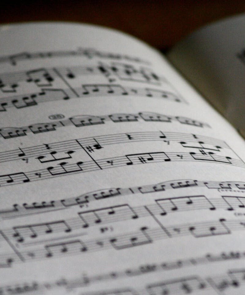 Detailed close-up of a music sheet showing complex musical notes and compositions.