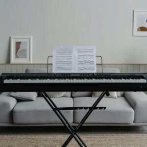A stylish living room featuring a piano and modern decor, perfect for music enthusiasts.
