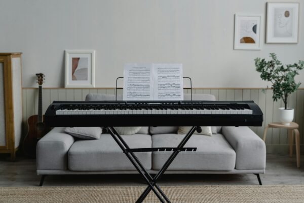 A stylish living room featuring a piano and modern decor, perfect for music enthusiasts.